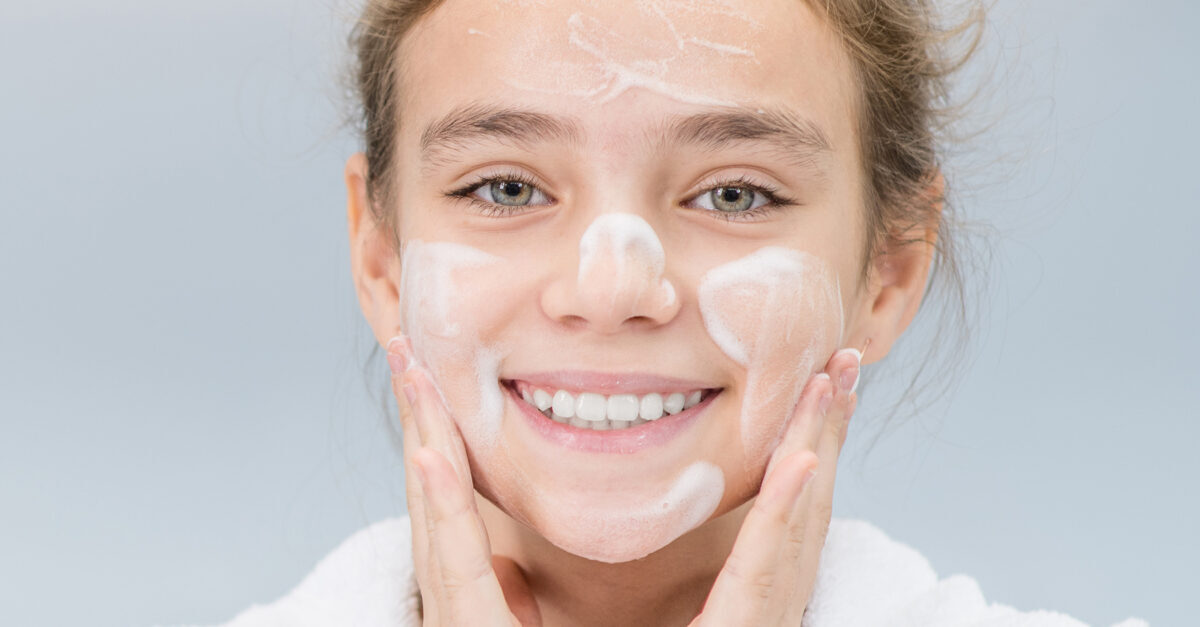 Teenage girl with cream